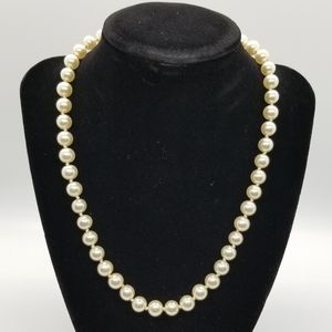 White pearl necklace.